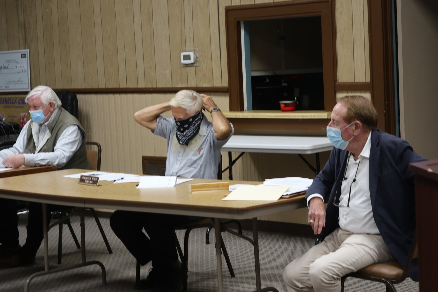 As soon as the Highland Town Board passed the motion to require masks for town employees and highly suggest that people wear masks in town buildings, board members whipped out their masks and put them on.